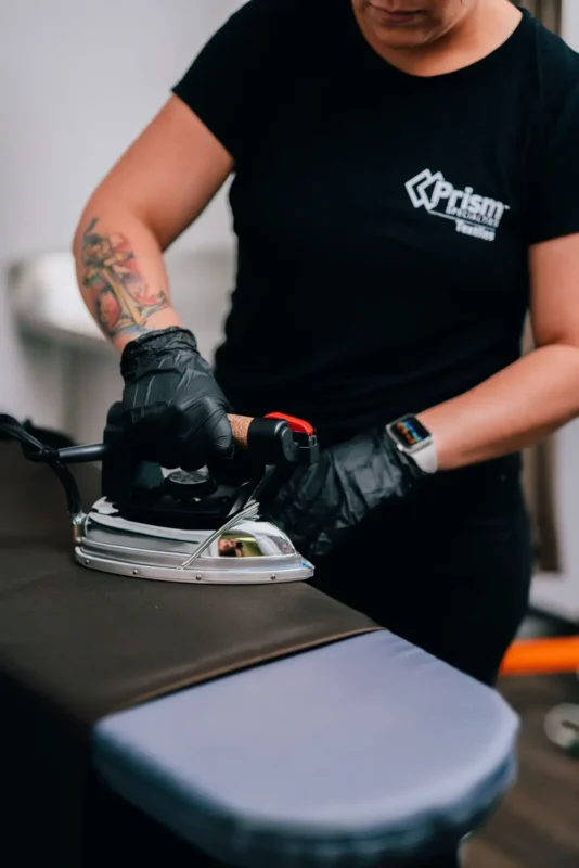 Woman ironing a piece of fabric